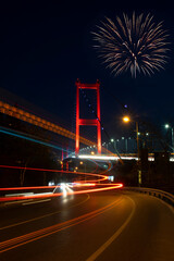 Fireworks display on the Bosphorus during the republic holiday in Istanbul. Fireworks exploding above the Bosphorus bridge. Long exposure view from the bridge in Istanbul.