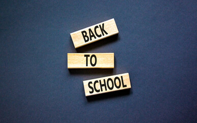 Back to school and support symbol. Concept words Back to school on wooden blocks. Beautiful black...