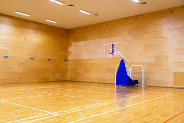 Mobile basketball basket inside the gym without people