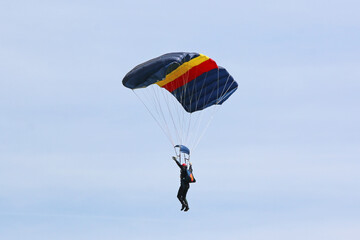 	
Skydiver flying wing in a blue sky	