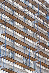 scaffolding on the facade of a house under construction