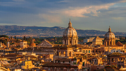 Naklejka na ściany i meble Panoramic view of Rome historical center old skyline at sunset with Church of St. Andrew of the Valley beautiful baroque dome