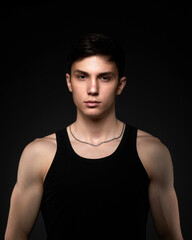 Teen athletic body on dark background