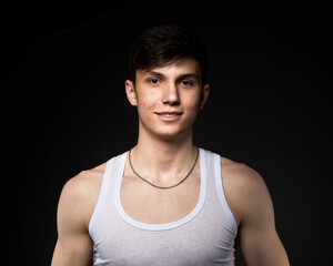 Teen athletic body on dark background