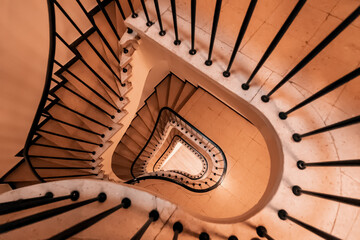 Geometric spiral pattern extending down the architectural elements of the stairs in the house