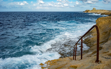 stairs into the water in the area of old salt pans in Gozo