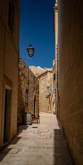 Citadel narrow path with a barrel  in Gozo 