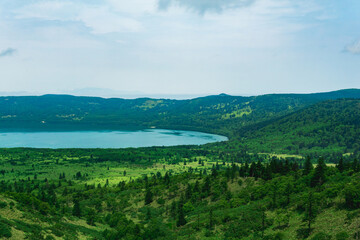 Fototapeta na wymiar natural landscape of Kunashir island, view of the Golovnin volcano caldera with hot lake