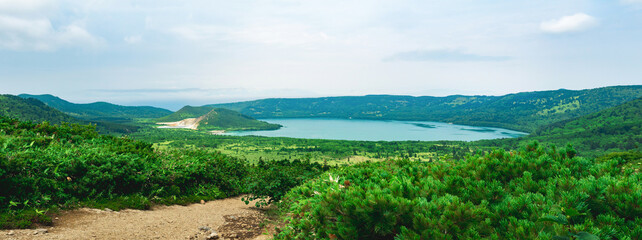 natural landscape of Kunashir island, view of the Golovnin volcano caldera with hot lakes and a...