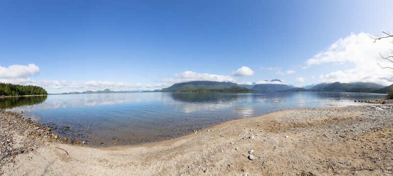 Scenic View of Kennedy Lake with Canadian Mountain Landscape in Background. Near Tofino and Ucluelet, Vancouver Island, British Columbia, Canada. Panorama