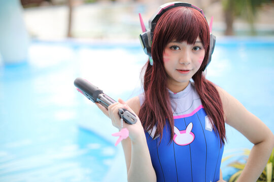Portrait of Japan anime cosplay girl with swim suit at swimming pool