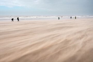 Fototapeta na wymiar Wind storm at the beach of Scheveningen (The Hague) in The Netherlands. Dutch coastline by Scheveningen during the storm Eunice
