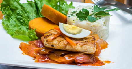 Escabeche fried fish onion salad boiled egg peruvian traditional gourmet food