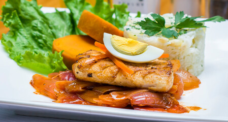 Escabeche fried fish onion salad boiled egg peruvian traditional gourmet food