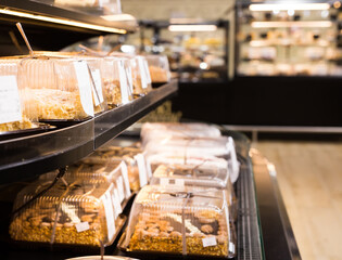 variety of sweet delicious cakes on the shop window of a cafe
