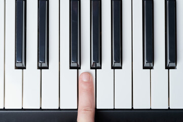 Push white piano key