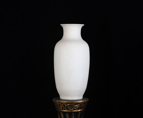 vintage classic white vase isolated on black background