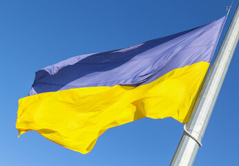 Flag of Ukraine on a background of blue sky
