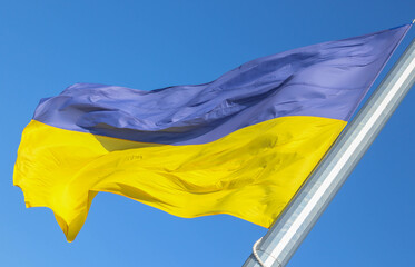 Flag of Ukraine on a background of blue sky