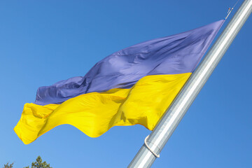 Flag of Ukraine on a background of blue sky