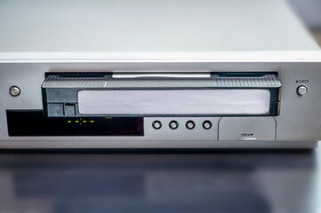Combined VHS and CD player. playing old VHS cassettes, old electrical and electronic devices,...