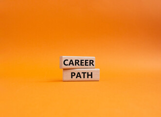 Career path symbol. Concept word Career path on wooden blocks. Beautiful orange background. Business and Career path concept. Copy space