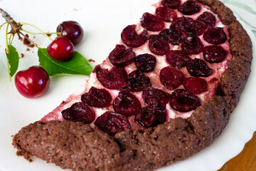 Chocolate biscuit with cherries. Shortbread chocolate dough pie with cottage cheese filling with cherries. cottage cheese pie with cherries