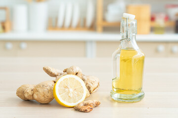 Various spices and Lemon on a wooden table. Herbal aromatic oil of Ginger, cinnamon, ginger on a wooden board.