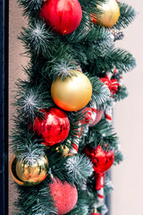 Christmas and New Year decor with bright toys and decorations on a Christmas tree branch