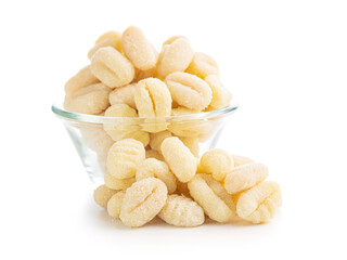 Uncooked potato gnocchi isolated on white background.