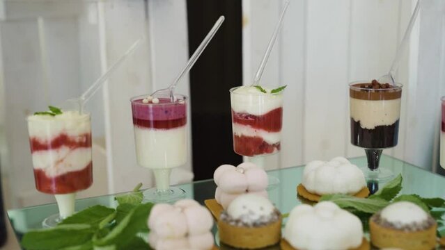 Variety of delicious desserts, cakes with cream, chocolate , whipped creaC
