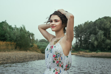 Portrait of a girl in a dress on the background of nature. Walk in nature.