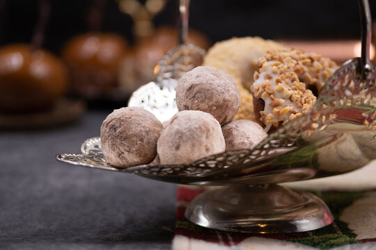 Doughnuts And Doughnut Holes On Silver Dessert Stand