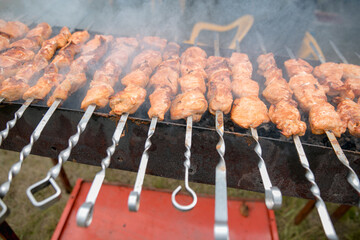 Grilling shashlik on barbecue grill. Selective focus