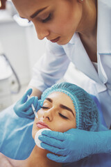 Naklejka premium Woman at the plastic surgeon