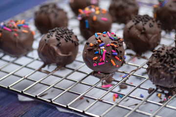 Chocolate donut holes with sprinkles