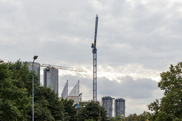 Obraz premium A large construction crane on the background of skyscrapers