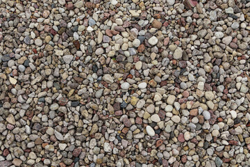 Natural background of round stones texture pattern. Stone pattern