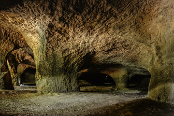 System of caves in sandstone rocks called Puste kostely near Novy Bor, Czech republic.Large underground quarry.Popular tourist attraction.Mysterious scary atmosphere.Czech nature