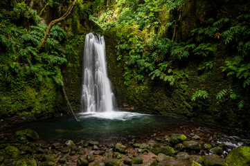 Beautiful waterfall in lush tropical forest