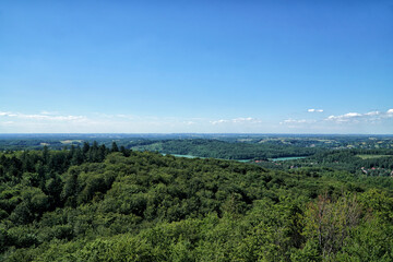 Kashubia landscape aerial view. View on Ostrzyckie Lake from observation tower located at the top of the Wiezyca hill on the  in summer. Hills covered green forests with lakes. Kashubia, Poland.
