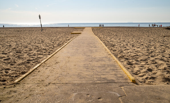 Wooden boardwalk across the sandy beach in the seaside town of Lowestoft on the Suffolk coast