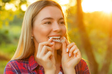 White Smile. Portrait Of Beautiful Smiling Woman With Healthy Straight White Teeth Holding Teeth...