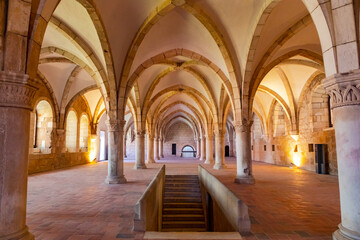 Fototapeta na wymiar The empty hall of the canteen with the columns and the vaulted ceiling in the monastery of Alcobaca, Portugal