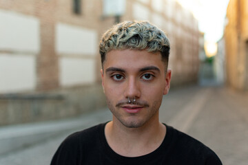 Serious adult man posing looking at camera
