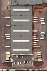 Aerial view of a warehouse with goods. Logistics center in the industrial zone of the city, many...
