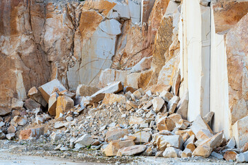View of a crumbling rock, stones fall from a cliff, sandy cliffs