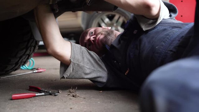 auto mechanic repairs SUV. auto repair shop.