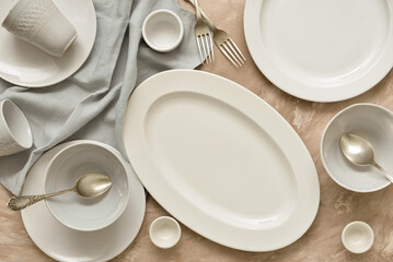 Set of clean tableware on grunge background, top view