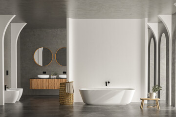 Bright bathroom interior with concrete floor and wall, white bathtub and two sinks, toilet and bidet, towel, side view. Minimalist bathroom with modern furniture and arches, 3D rendering no people
